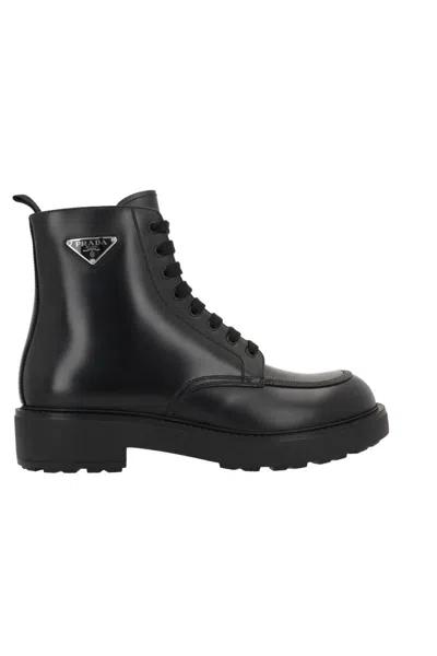 Prada Logo-plaque Panelled Ankle Boots In Black