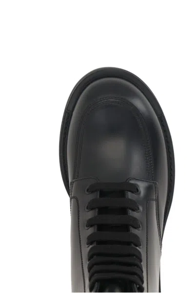 Prada Logo-plaque Panelled Ankle Boots In Black