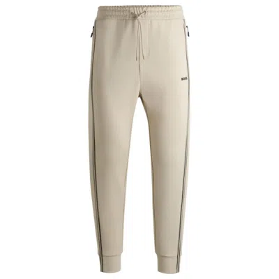 Hugo Boss Tracksuit Bottoms With Tape Inserts In Beige