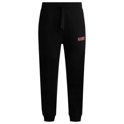Hugo Boss Cotton-terry Tracksuit Bottoms With Logo Print In Black