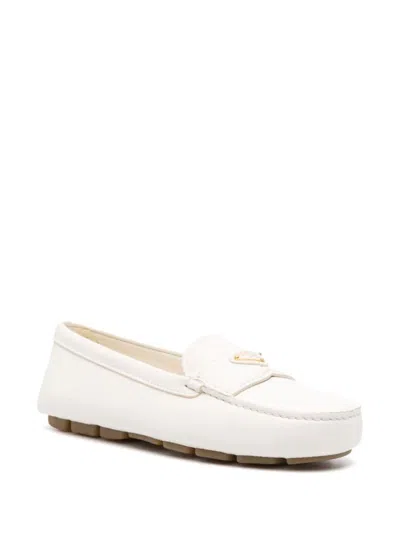Prada Triangle Logo Grained Leather Loafers In Beige