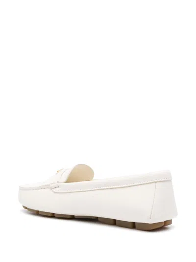 Prada Triangle Logo Grained Leather Loafers In Beige