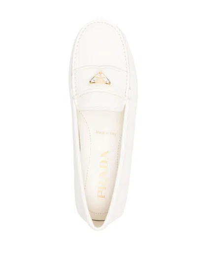 Prada Triangle Logo Grained Leather Loafers In Beige