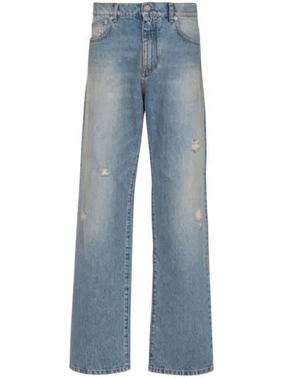 Balmain Distressed And Ripped Blue Jeans In Blue