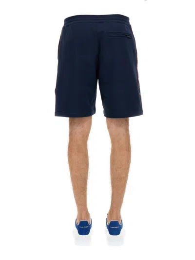 Alexander Mcqueen Men Bermuda Shorts With Selvedge Logo Band In Blue