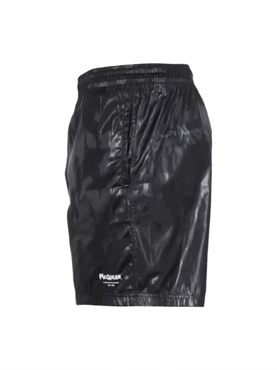 Alexander Mcqueen Solid Color Swim Shorts With Graffiti Print In Black