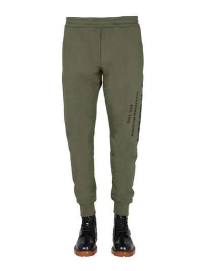 Alexander Mcqueen Jogging Pants With Graffiti Logo In Brown