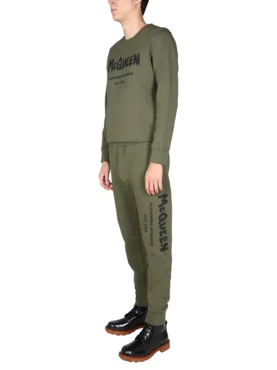 Alexander Mcqueen Jogging Pants With Graffiti Logo In Brown