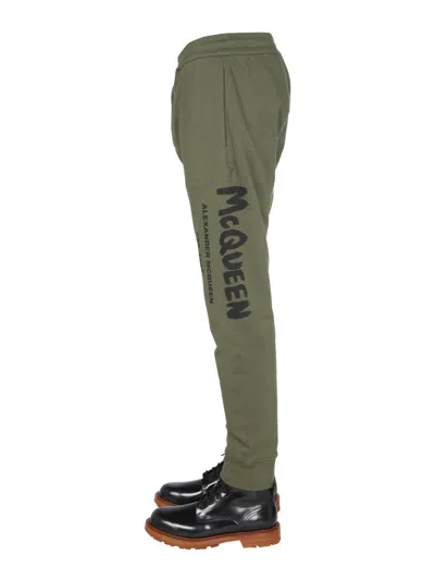 Alexander Mcqueen Jogging Pants With Graffiti Logo In Brown
