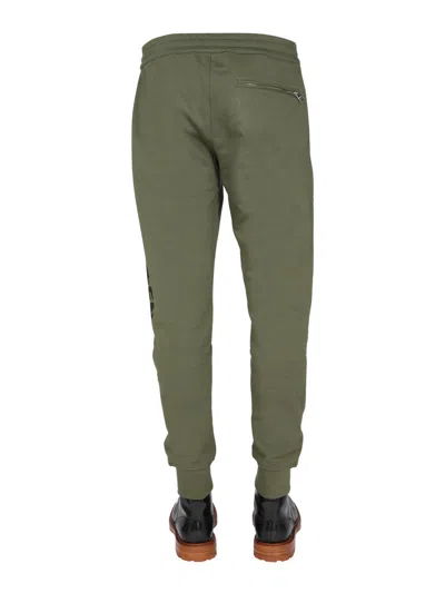 Alexander Mcqueen Jogging Pants With Graffiti Logo In Brown