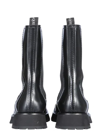 Alexander Mcqueen Men Studded Boot In Black
