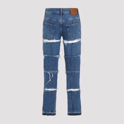Alexander Mcqueen Low-rise Distressed Jeans In Blue