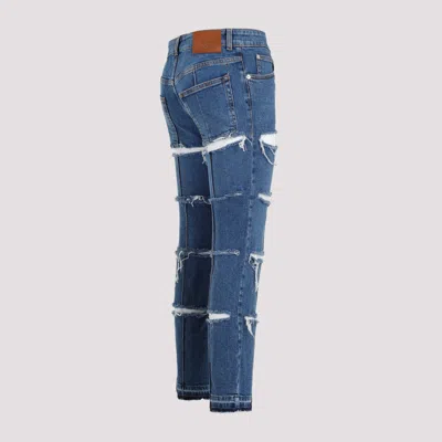 Alexander Mcqueen Low-rise Distressed Jeans In Blue