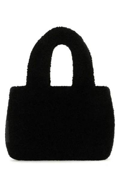 Amina Muaddi Shearling Handbag With Twin Handles And Structured Silhouette In Black