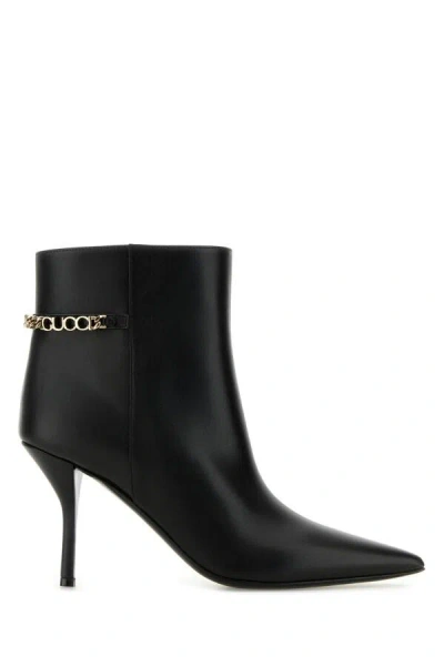 Gucci Signoria Leather Chain Ankle Booties In Black
