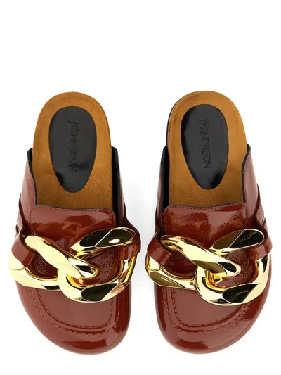 Jw Anderson Glossy Leather Mules In Brown