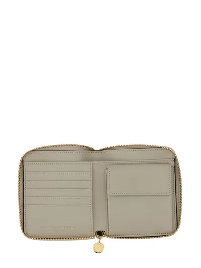 Stella Mccartney Zipped Wallet With Circular Logo And Gold Hardware In Black