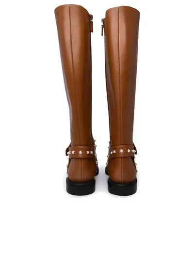 Stuart Weitzman Leather Pearl Moto Boots In Brown