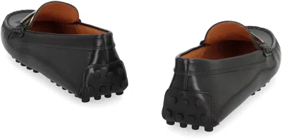Tod's Loafers With Golden Detail And Gommino Sole In Black