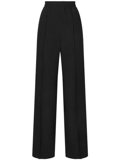 Dolce & Gabbana Flared Wool Jacquard Pants With Dg Logo In Black