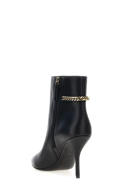 Gucci Signoria Leather Chain Ankle Booties In Black