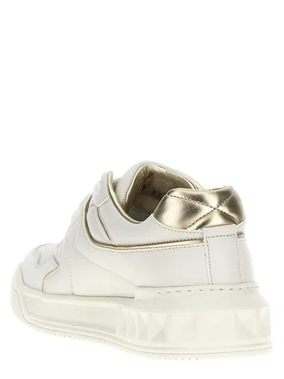 Valentino Perforated Leather Studded Sneakers In Gold