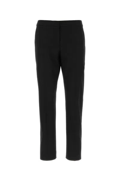 Dries Van Noten Pinstripped Wool Trousers In Black