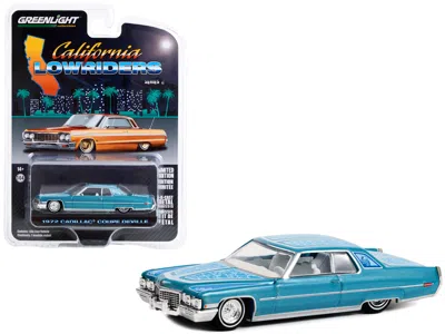 Greenlight 1972 Cadillac Coupe Deville Custom Light Blue Metallic With White Interior And Graphics "california