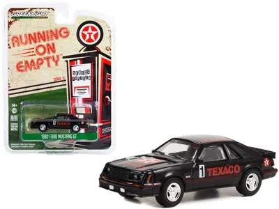 Greenlight 1982 Ford Mustang Gt #1 Black "texaco" "running On Empty" Series 15 1/64 Diecast Model Car By Greenl
