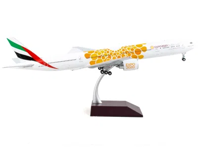 Geminijets Boeing 777-300er Commercial Aircraft "emirates Airlines - Dubai Expo 2020" White With Orange Graphic