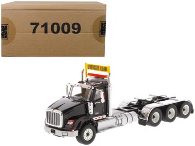 Diecast Masters International Hx620 Day Cab Tridem Tractor Black 1/50 Diecast Model By