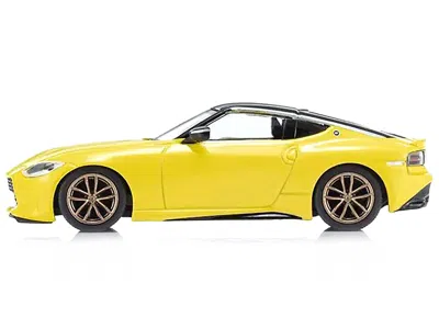 Kyosho Nissan Fairlady Z Rhd (right Hand Drive) Ikazuchi Yellow With Black Top With Mini Book No.13 1/64 Di
