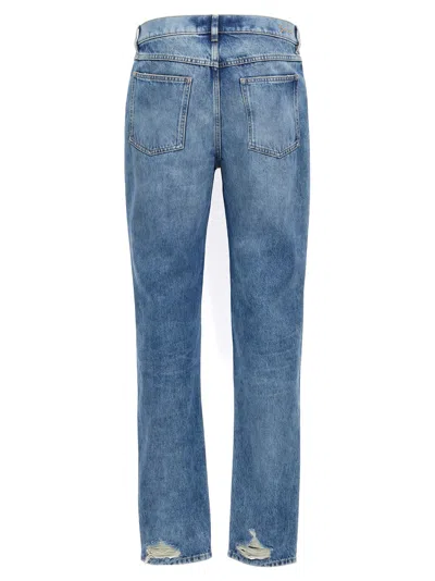Givenchy Washed Denim Tapered Leg Jeans With Contrast Stitching