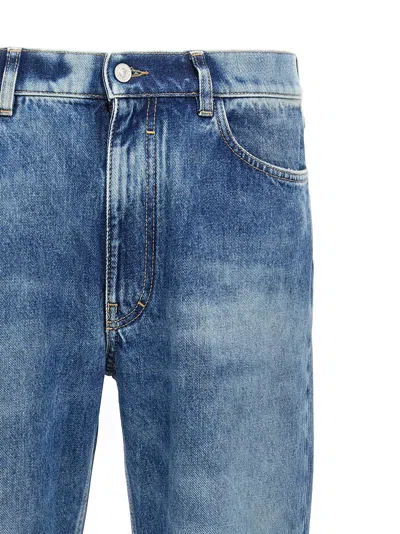 Givenchy Washed Denim Tapered Leg Jeans With Contrast Stitching
