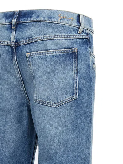Givenchy Washed Denim Tapered Leg Jeans With Contrast Stitching