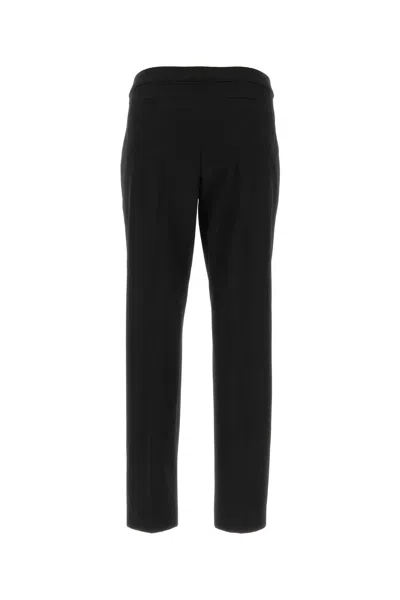 Dries Van Noten Pinstripped Wool Trousers In Black