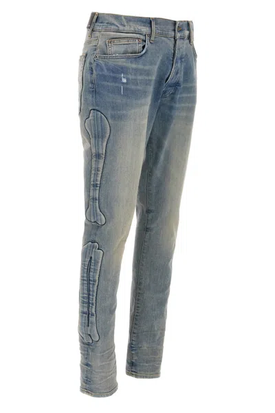 Amiri '3d Bones' Light Blue Jeans With 3d Detail On The Side And Logo Lettering On The Rear In Blue