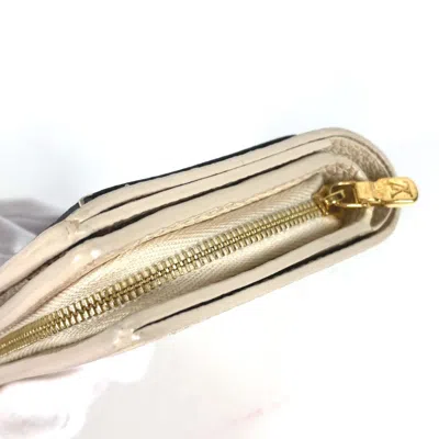 Pre-owned Louis Vuitton Beige Other Wallet (bi-fold) ()
