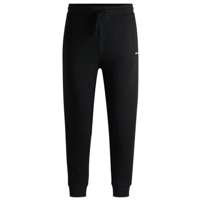 Hugo Boss Cotton-terry Tracksuit Bottoms With Logo Print In Black