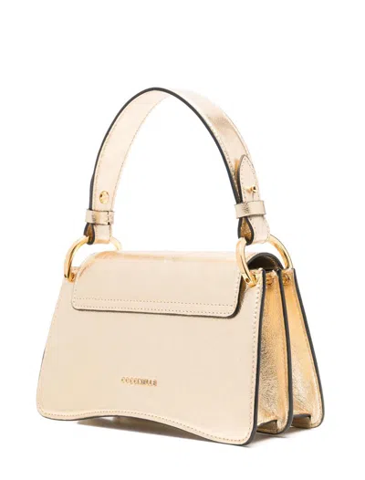Coccinelle Bags In Gold