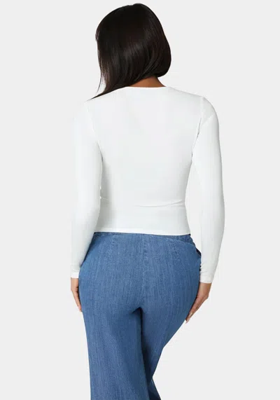 Bebe Cut Out Flower Long Sleeve Top In White Alyssum