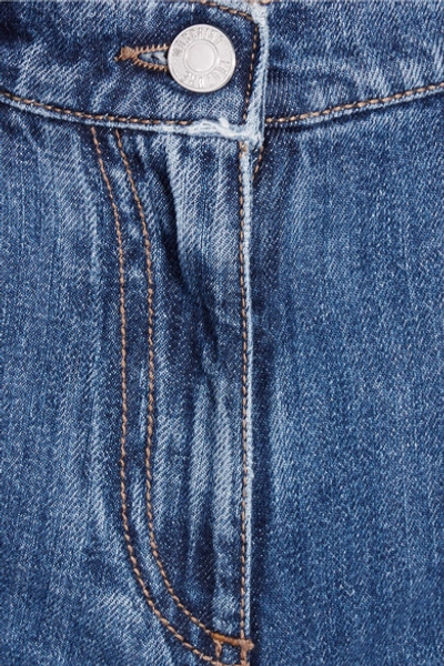 Shop Moschino Distressed Mid-rise Slim-leg Jeans