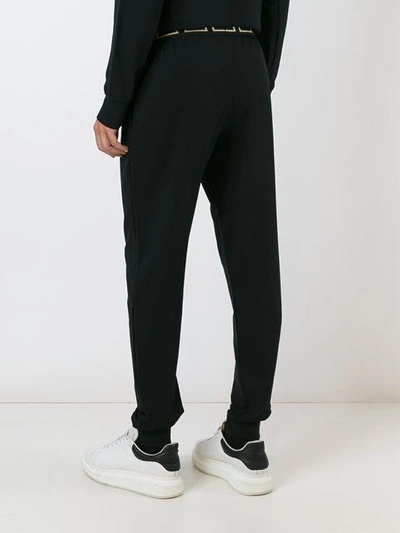 Shop Versace 'greca' Waistband Track Pants