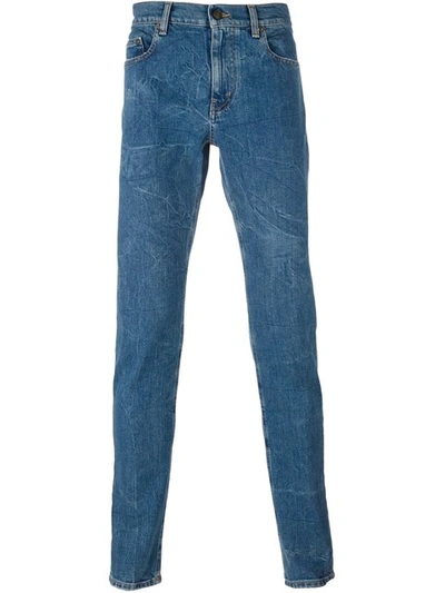 Saint Laurent Wrinkle-effect Mid-rise Skinny Jeans In Mid-blue