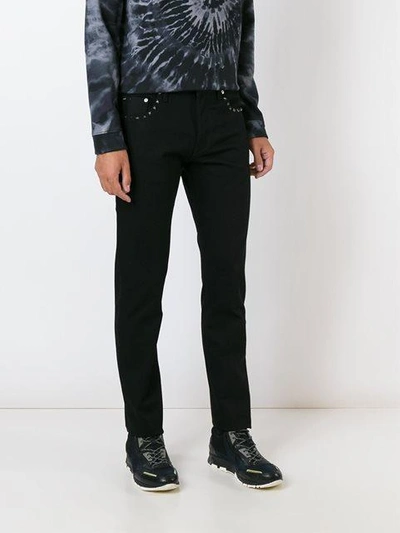 Shop Valentino 'rockstud' Slim-fit Jeans In Black