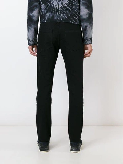 Shop Valentino 'rockstud' Slim-fit Jeans In Black