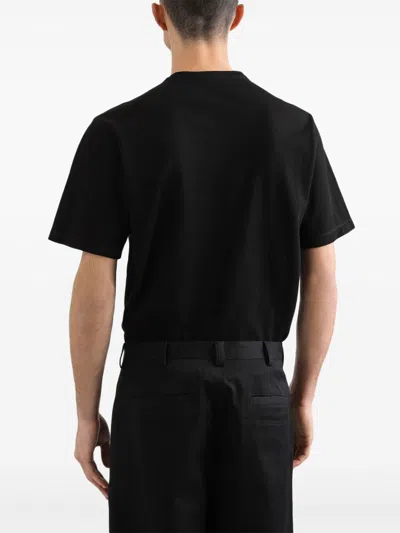Dolce & Gabbana Cotton T-shirt With Metal Plaque Featuring Front Logo In Black