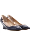 VALENTINO GARAVANI Valentino Garavani Rockstud patent leather wedge pumps