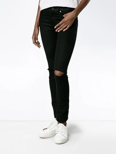 Shop Saint Laurent Distressed Skinny Jeans - Black