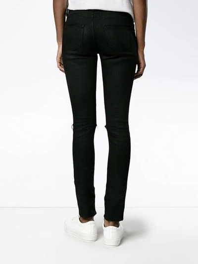 Shop Saint Laurent Distressed Skinny Jeans - Black